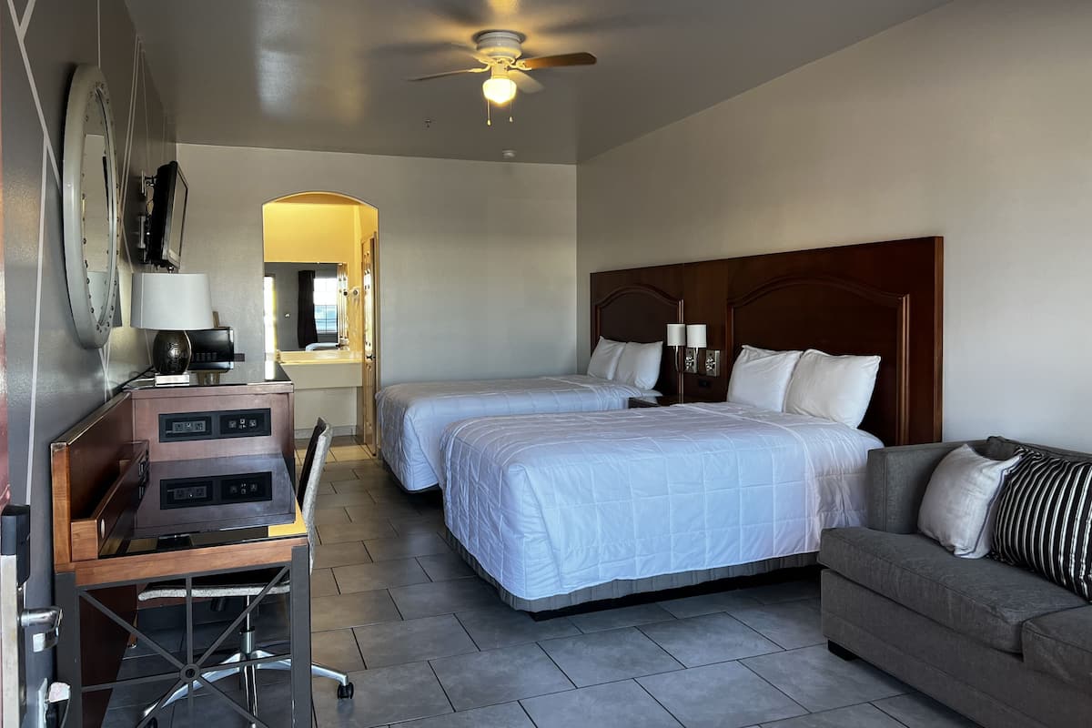 Standard Room with 2 Double Beds & a Sofa Sleeper | Desk, blackout drapes, iron/ironing board, bed sheets