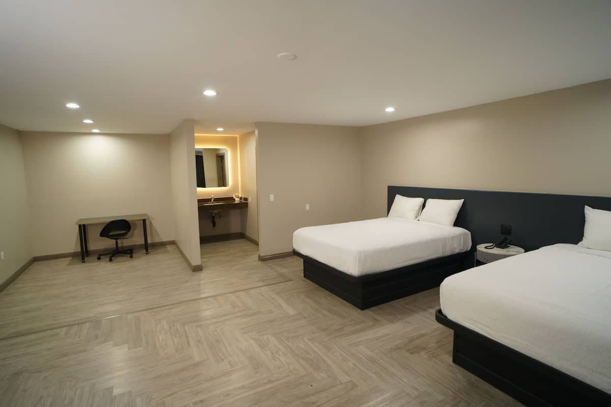 Family Room, 2 Queen Beds, Non Smoking | Premium bedding, desk, iron/ironing board (on request), WiFi (free)