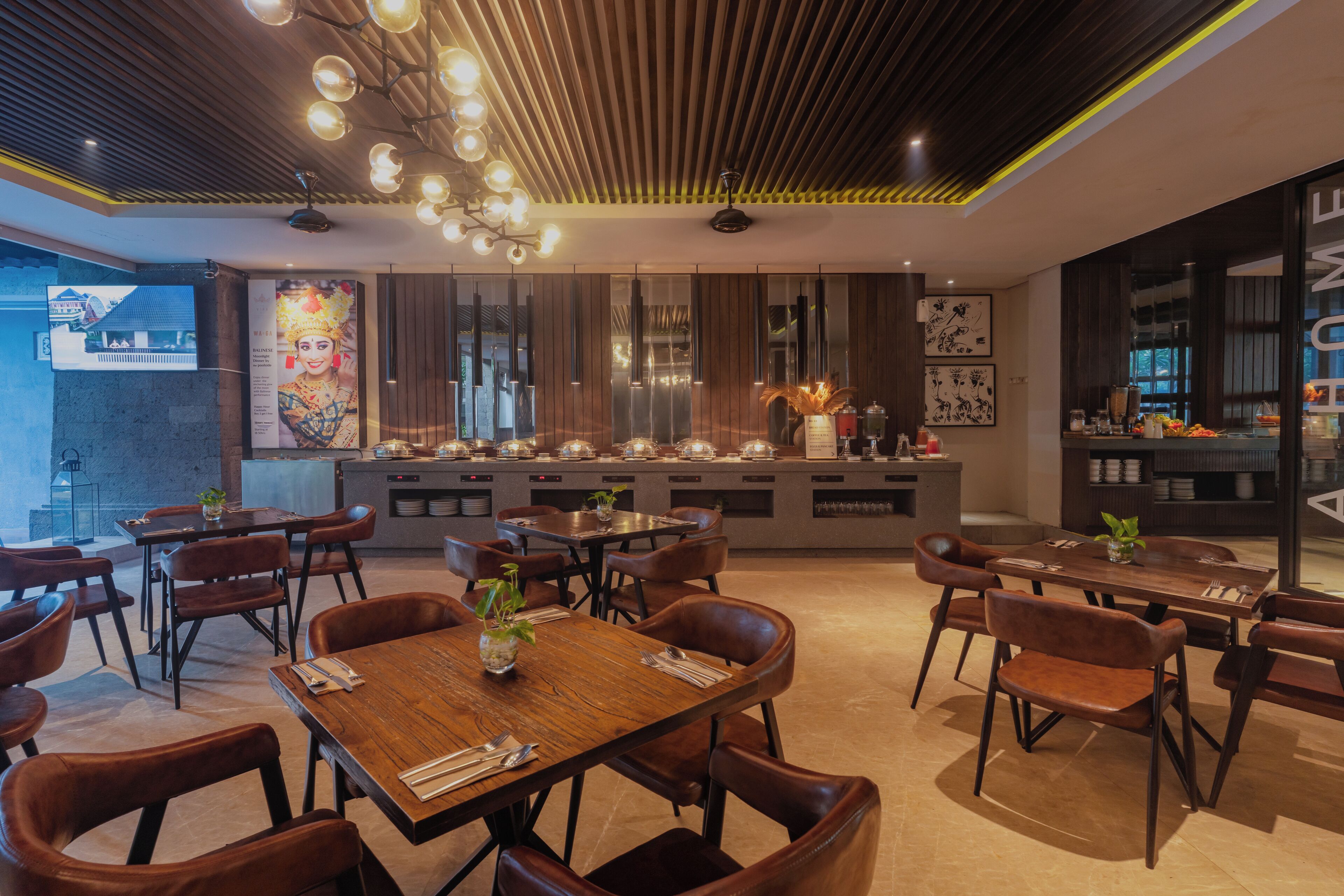 A modern restaurant with wooden tables and chairs, a bar area, and a large mirror wall.