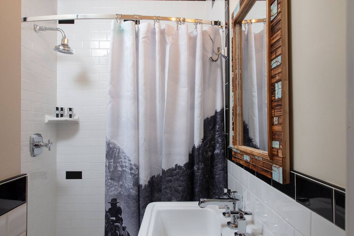 deluxe room, 1 king bed | bathroom | shower, free toiletries, hair dryer, towels