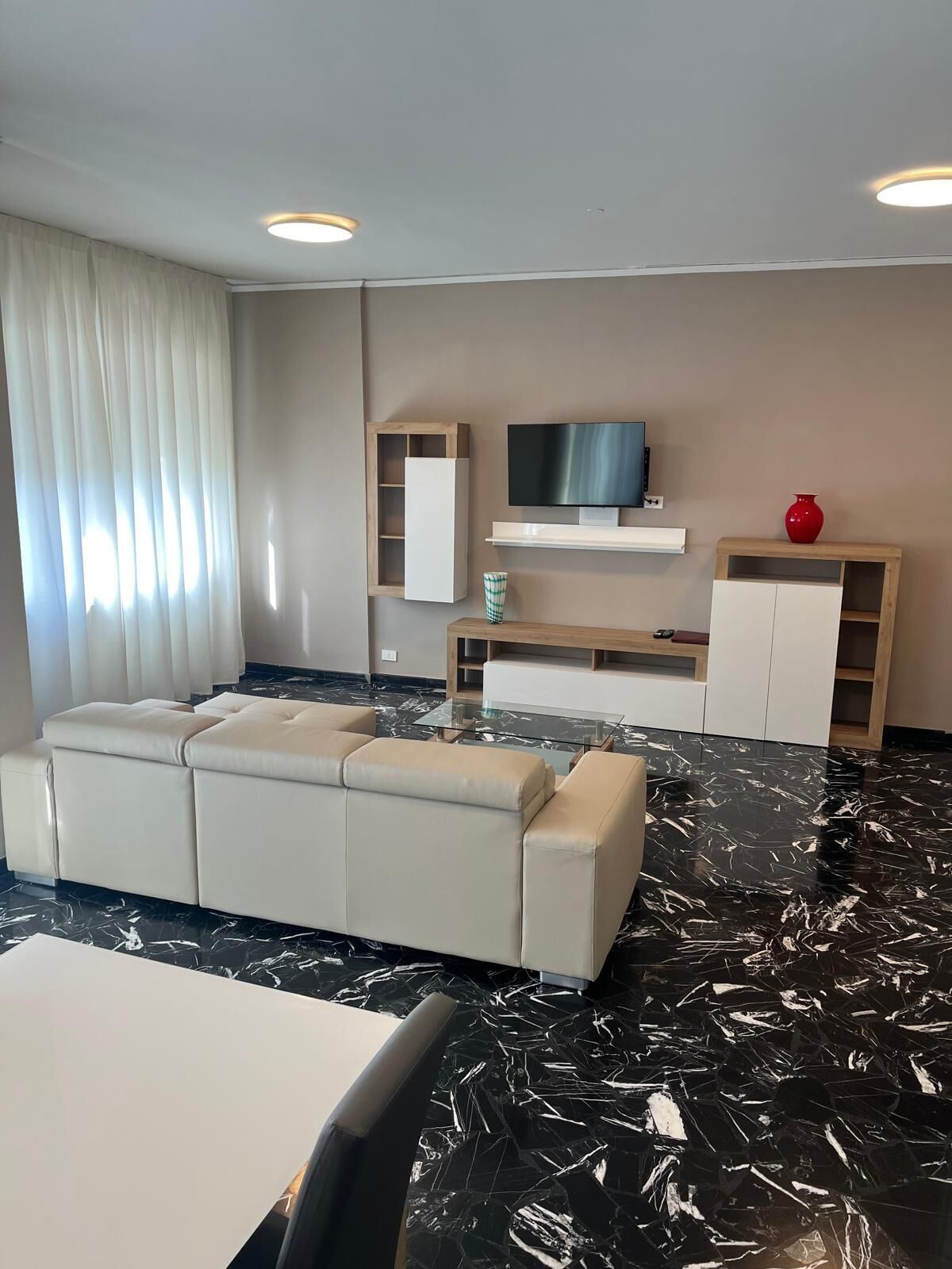 deluxe condo | living area | 36-inch lcd tv with satellite channels, tv, pay films