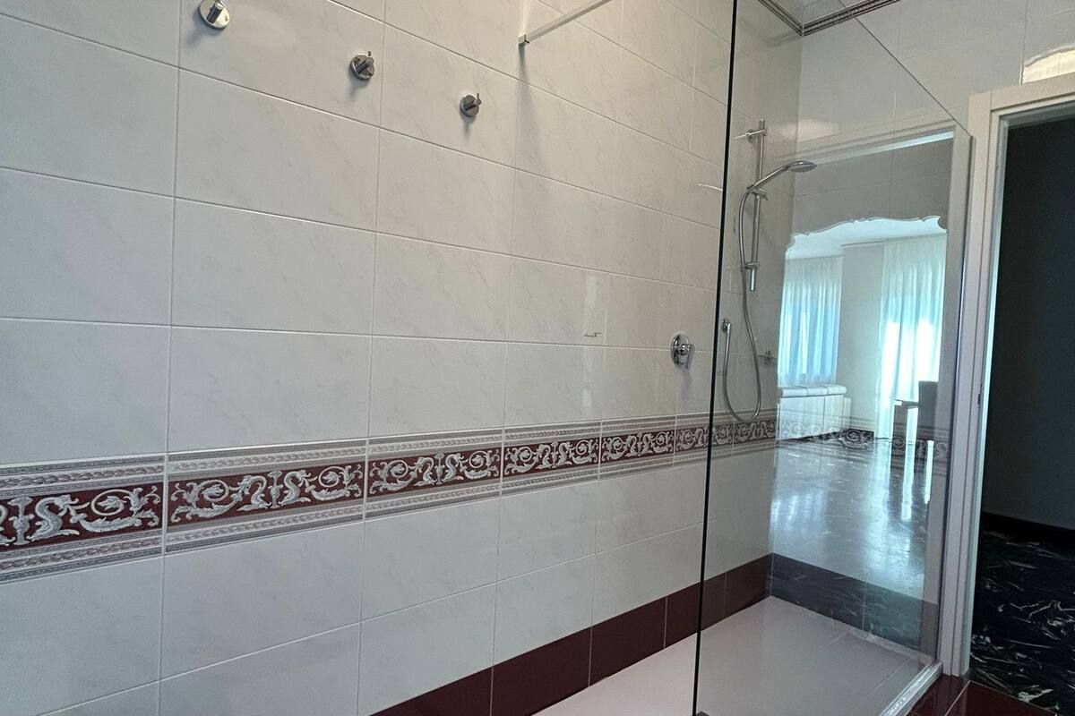 deluxe condo | bathroom | shower, rainfall showerhead, free toiletries, hair dryer