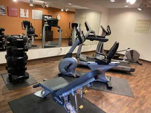 A fitness center with cardio machines, weight machines, and free weights. - Comfort Suites Coralville I-80 (Coralville)