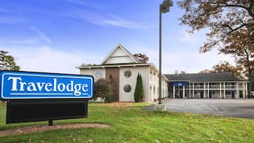 Travelodge hotel features a simple, modern design with a flat roof and symmetrical facade.