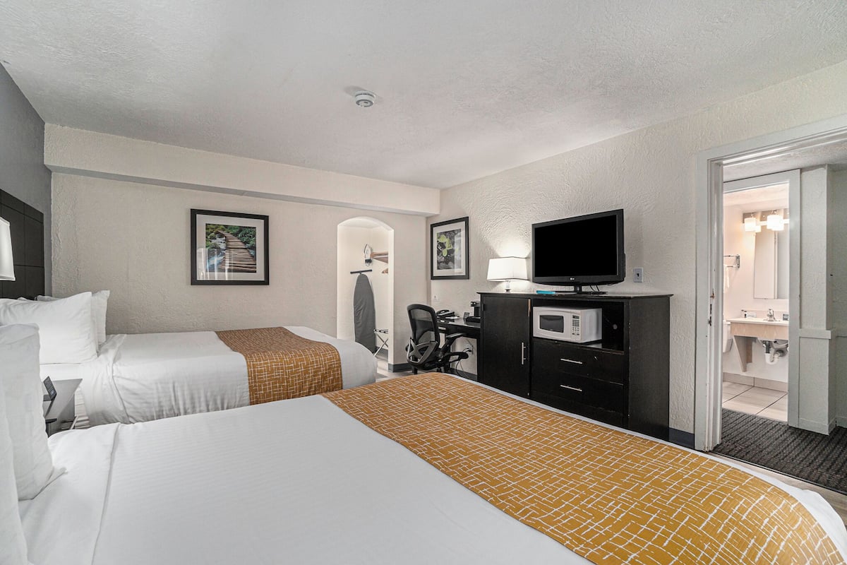 Room, 2 Bedrooms, Non Smoking (2 Bathrooms, 1st Floor, 3 Queen Beds) | 1 bedroom, desk, blackout drapes, iron/ironing board