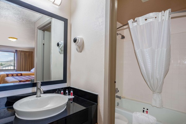 Combined shower/tub, hair dryer, towels, soap