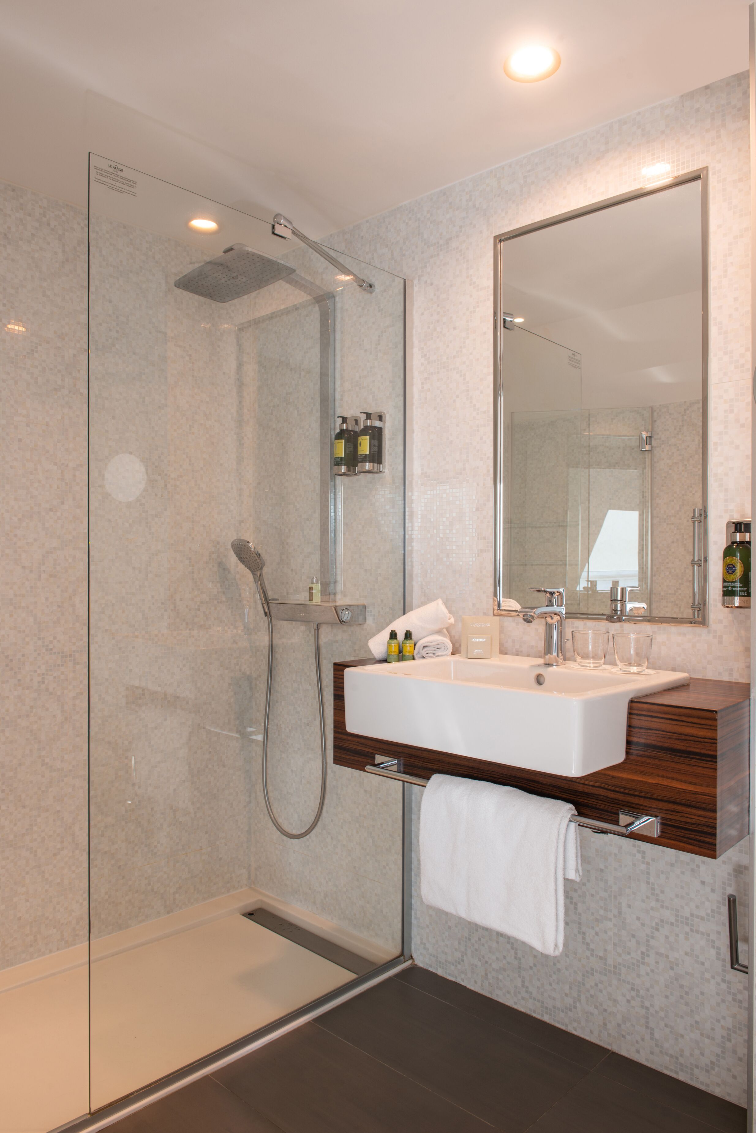 shower, designer toiletries, hair dryer, towels