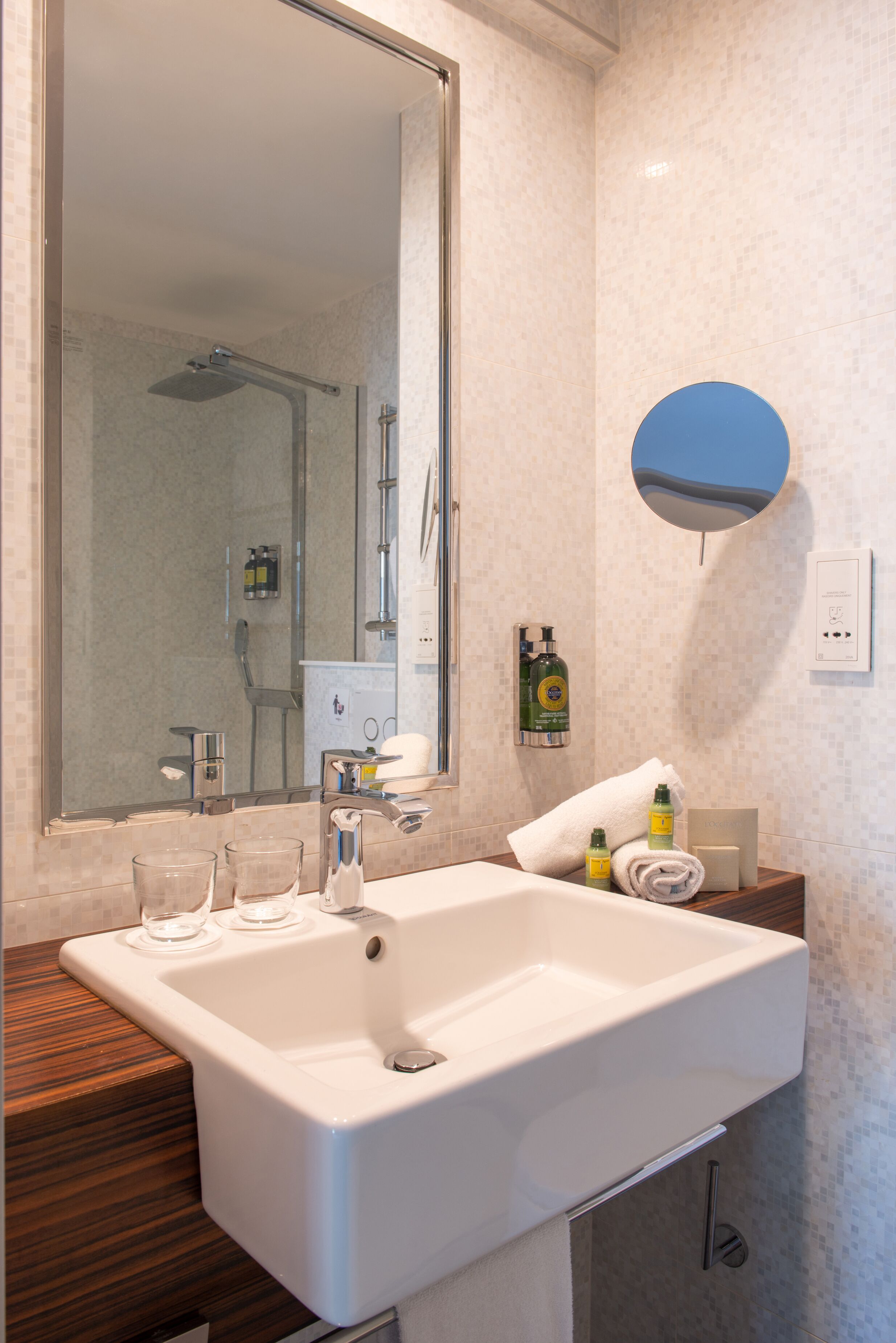 shower, designer toiletries, hair dryer, towels