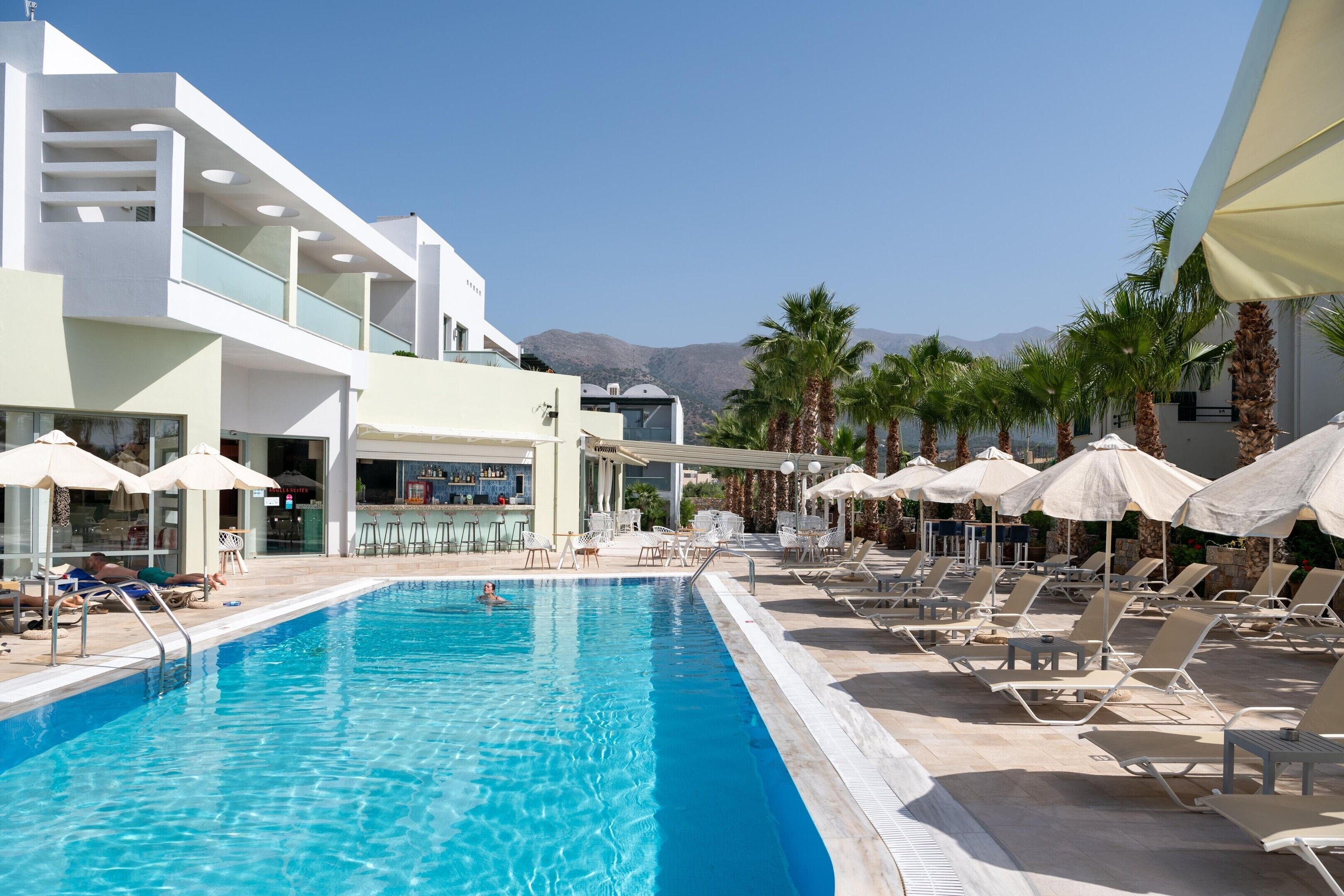 3 outdoor pools, open 9 AM to 7 PM, pool umbrellas, pool loungers
