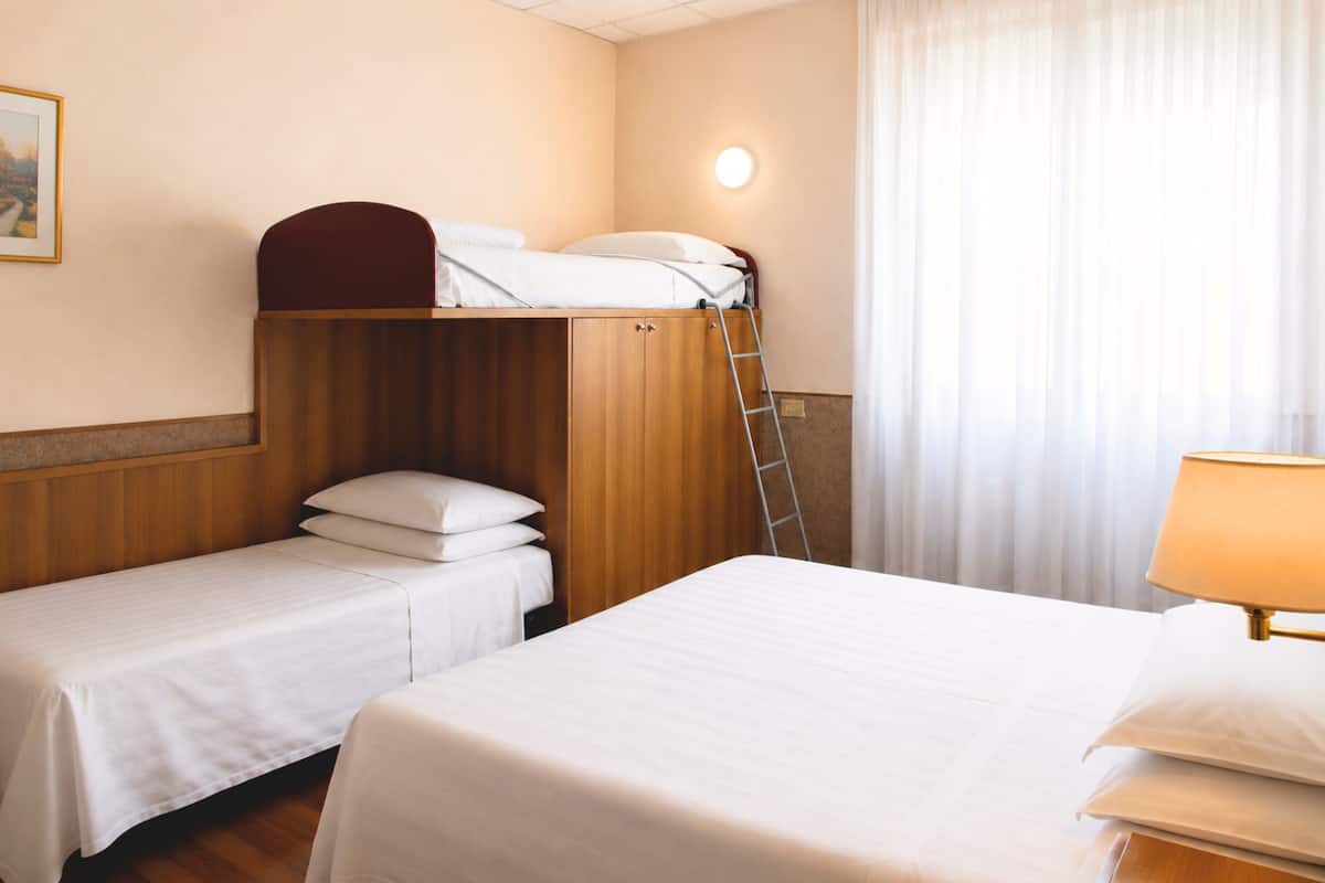 Family room | Minibar, in-room safe, desk, cribs (free)