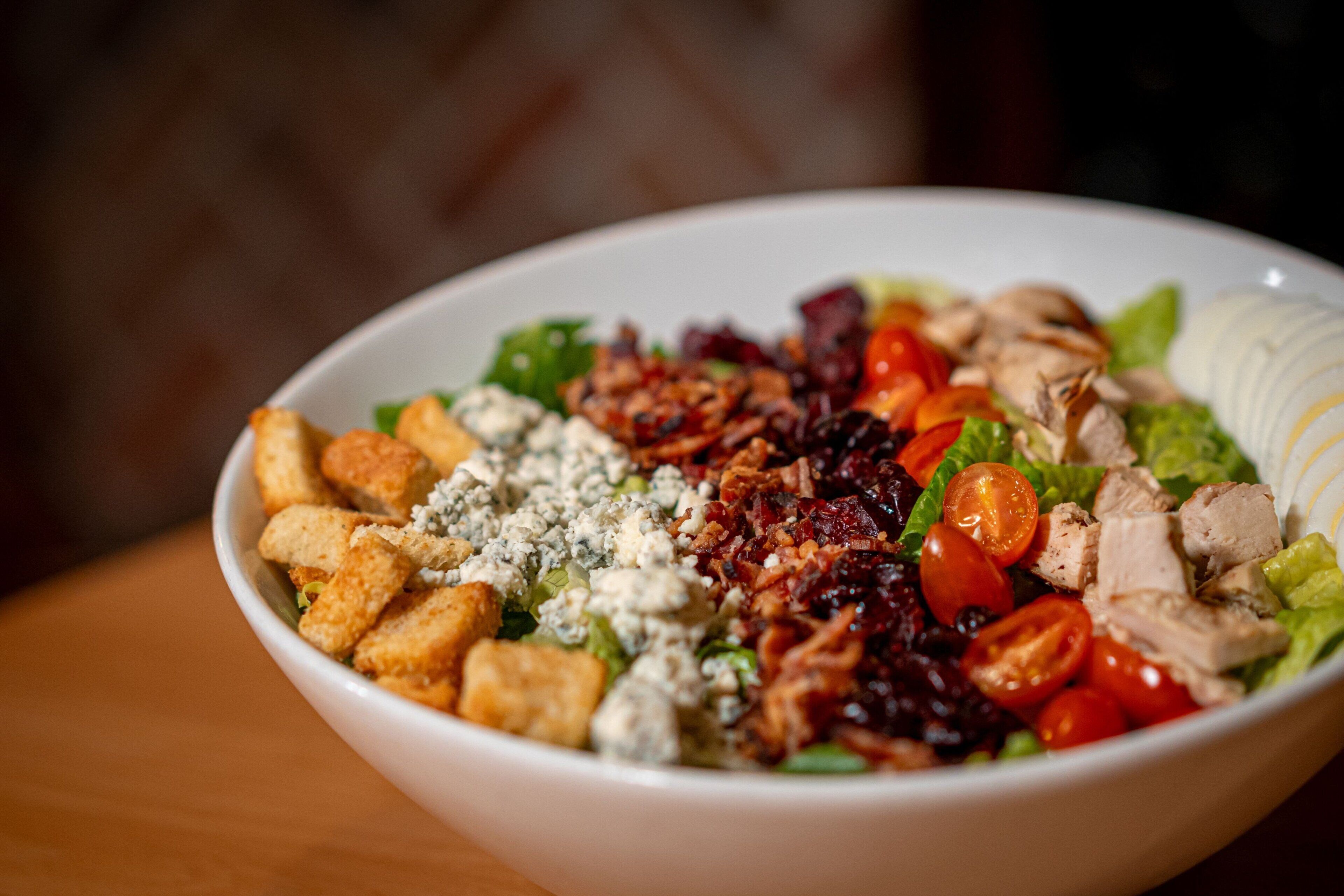 A bowl of salad with various ingredients.