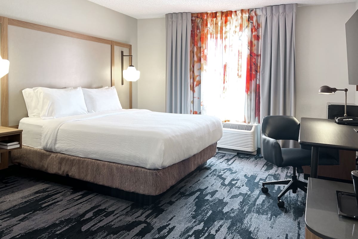 desk, laptop workspace, blackout curtains, iron/ironing board