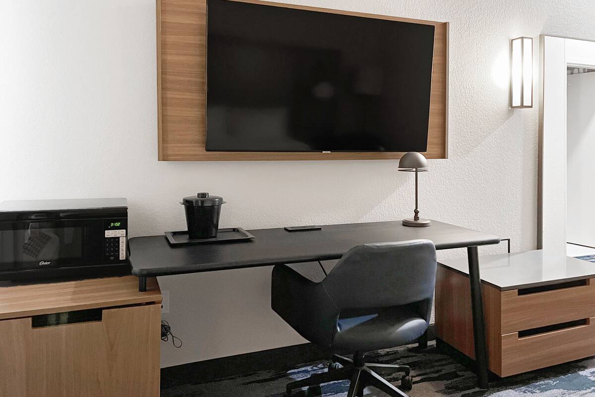 desk, laptop workspace, blackout curtains, iron/ironing board