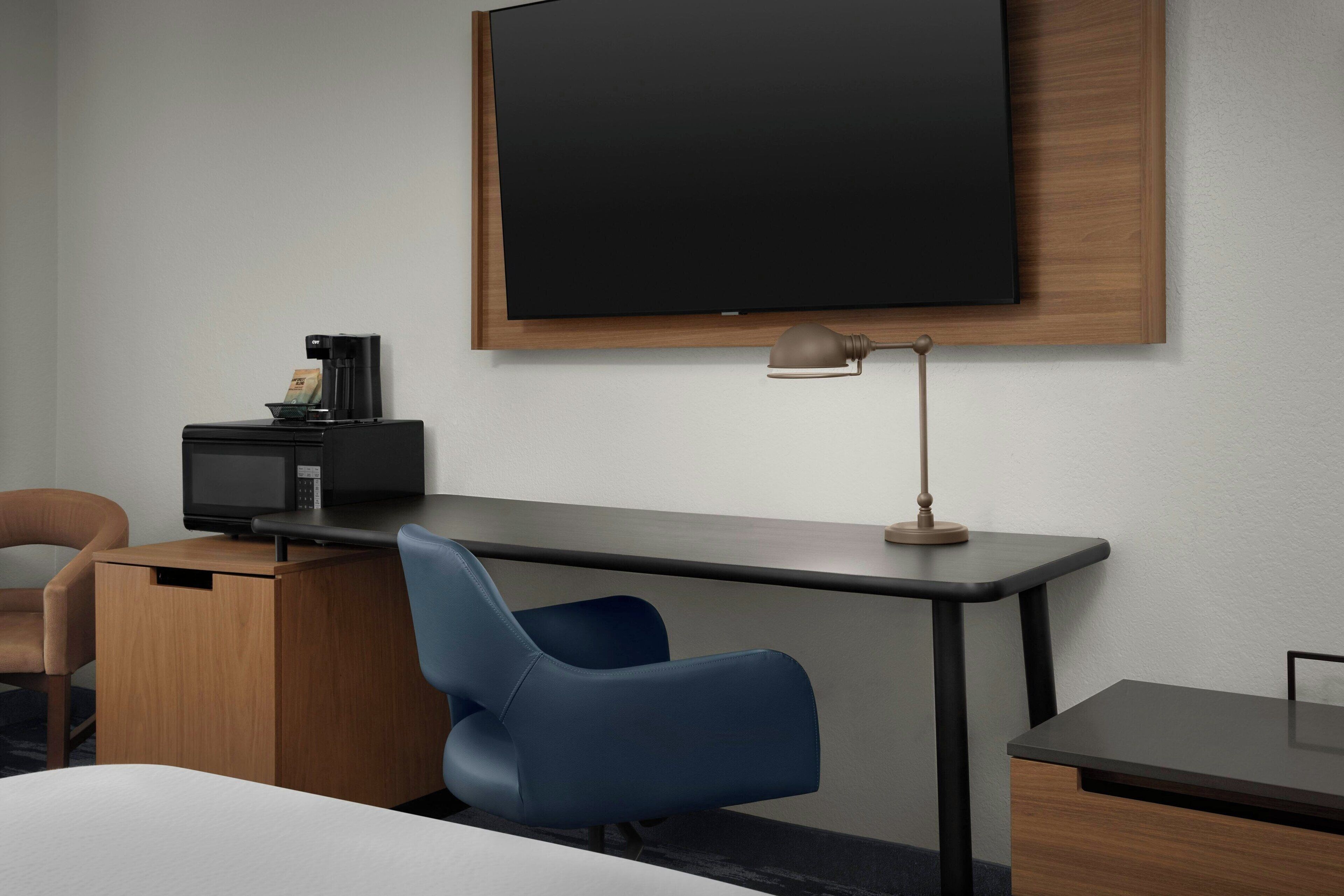 desk, laptop workspace, blackout curtains, iron/ironing board