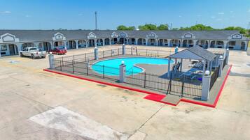 Guests can enjoy a refreshing swim in the central pool surrounded by a secure fenced area.
