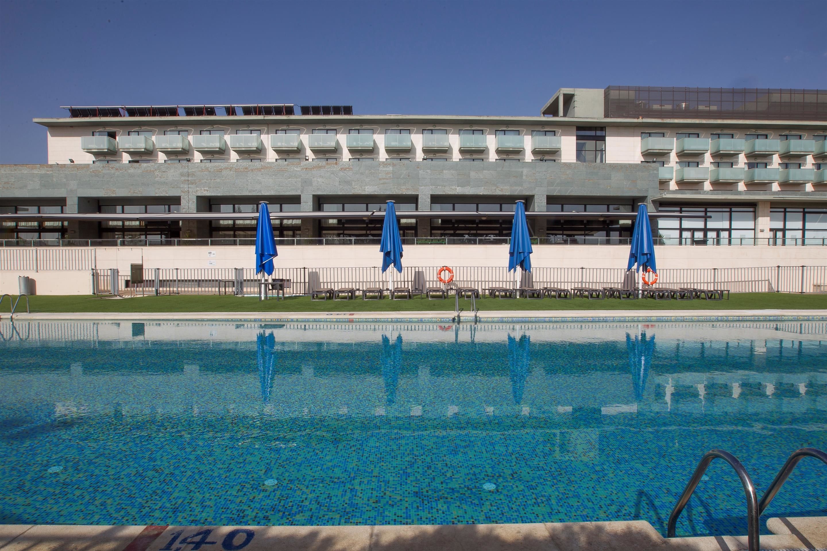 outdoor pool, open 11:00 am to 9:00 pm, pool umbrellas, pool loungers