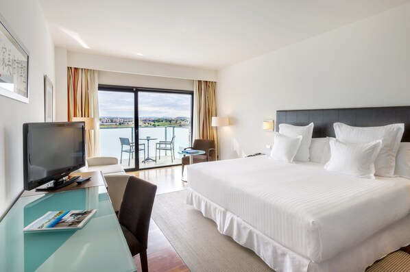 Hypo-allergenic bedding, down duvets, pillow-top beds, in-room safe