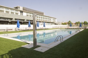 Outdoor pool, open 11:00 AM to 9:00 PM, pool umbrellas, pool loungers