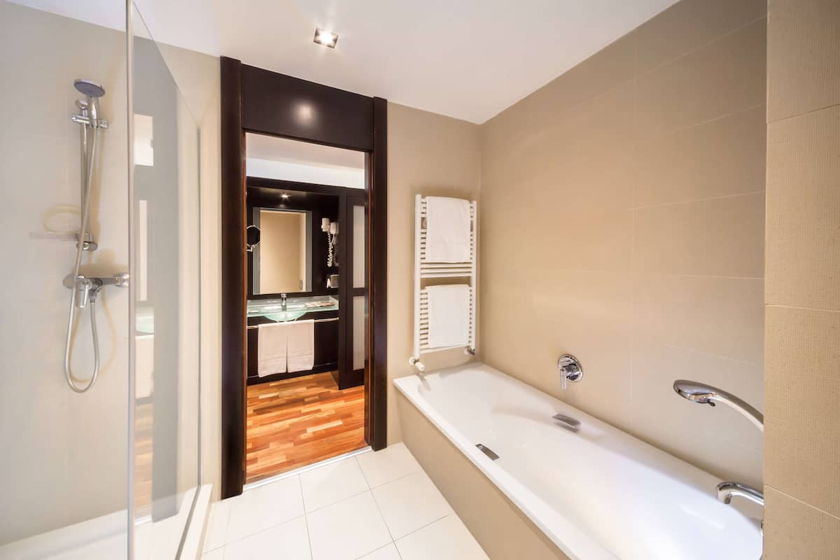 separate bathtub and shower, eco-friendly toiletries, hair dryer, bidet