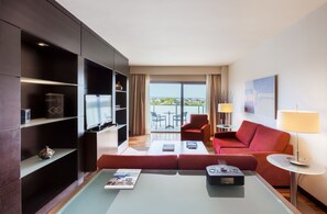 Enjoy city views from the large window, relax on the sofa, and unwind with a flat-screen TV.