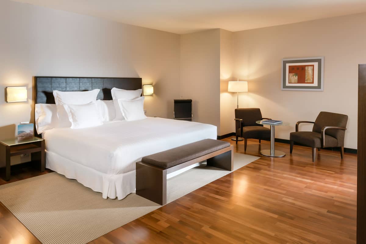 hypo-allergenic bedding, down duvets, pillow-top beds, in-room safe