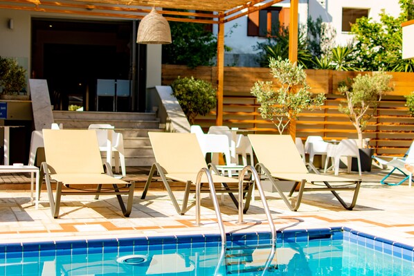 Outdoor pool, pool umbrellas, pool loungers