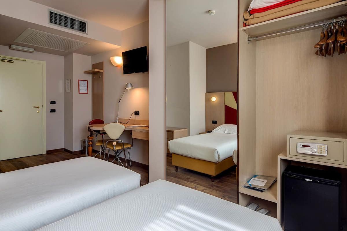 Twin Room | Minibar, in-room safe, desk, soundproofing