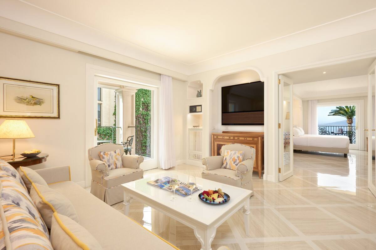 royal suite, balcony, sea view | living area | 40-inch flat-screen tv with satellite channels, tv