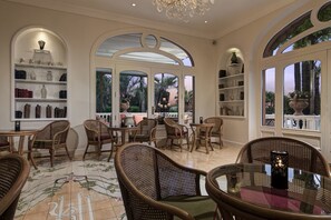 3 bars/lounges, rooftop bar, lobby lounge
