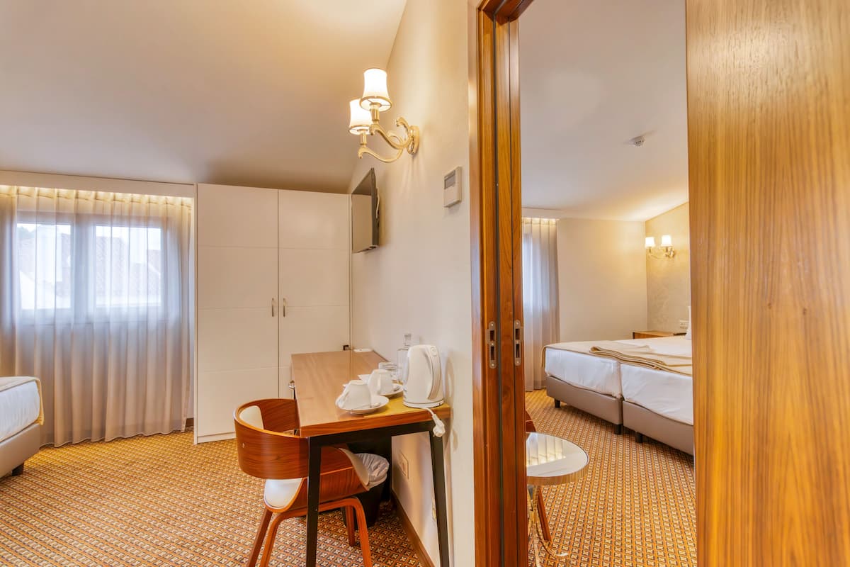 Deluxe Room, 2 Bedrooms | Minibar, in-room safe, desk, soundproofing