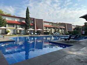 Outdoor pool, open 9:00 AM to 8:00 PM, pool umbrellas, sun loungers