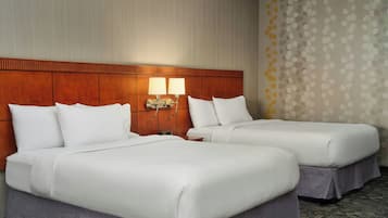 Pillowtop beds, desk, blackout drapes, iron/ironing board
