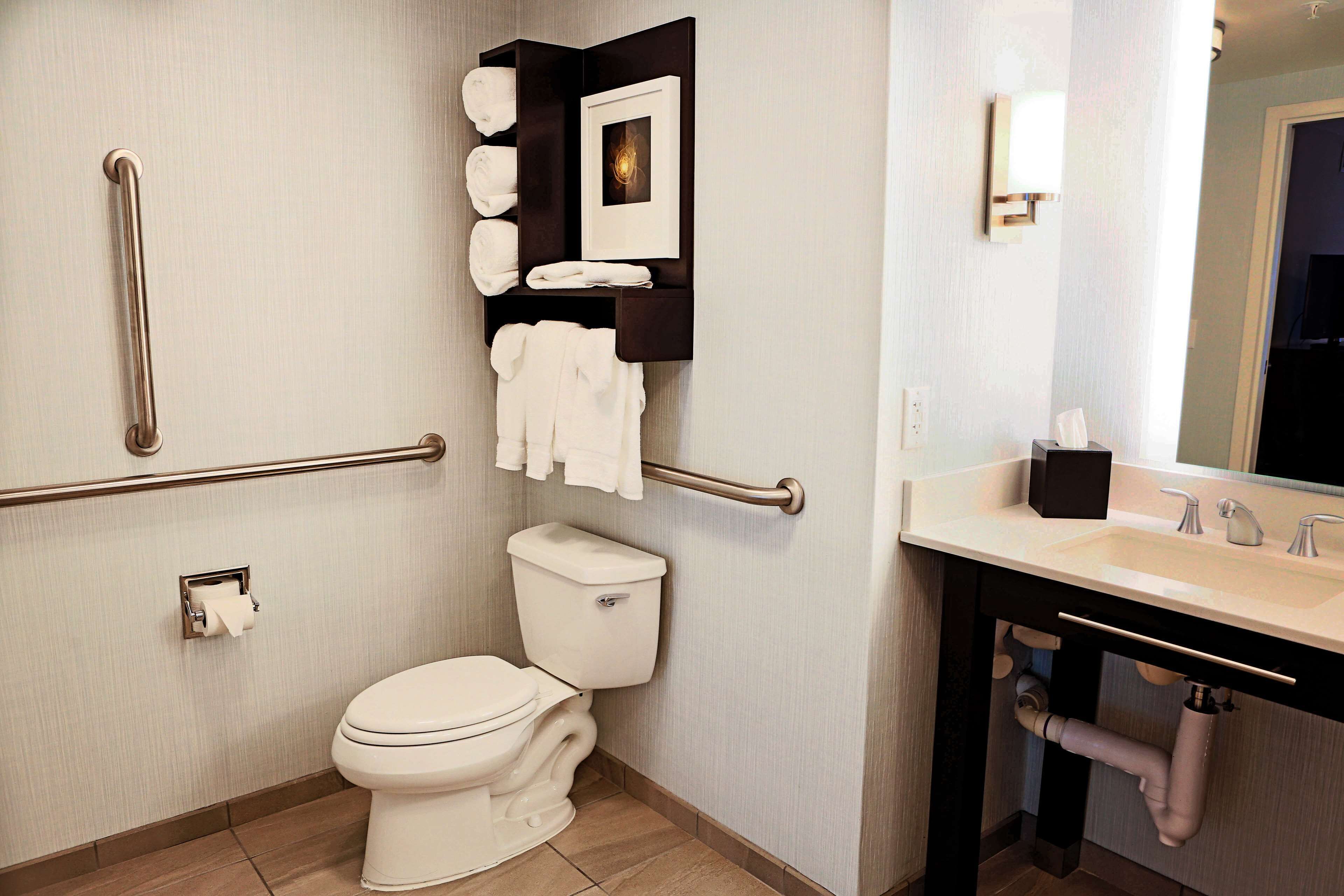 designer toiletries, hair dryer, towels