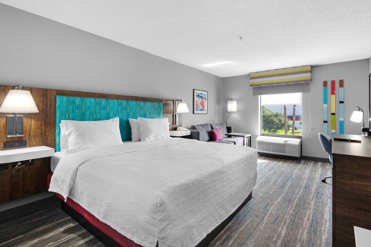 One king bed non smoking | Living area | 55-inch flat-screen TV with cable channels, TV