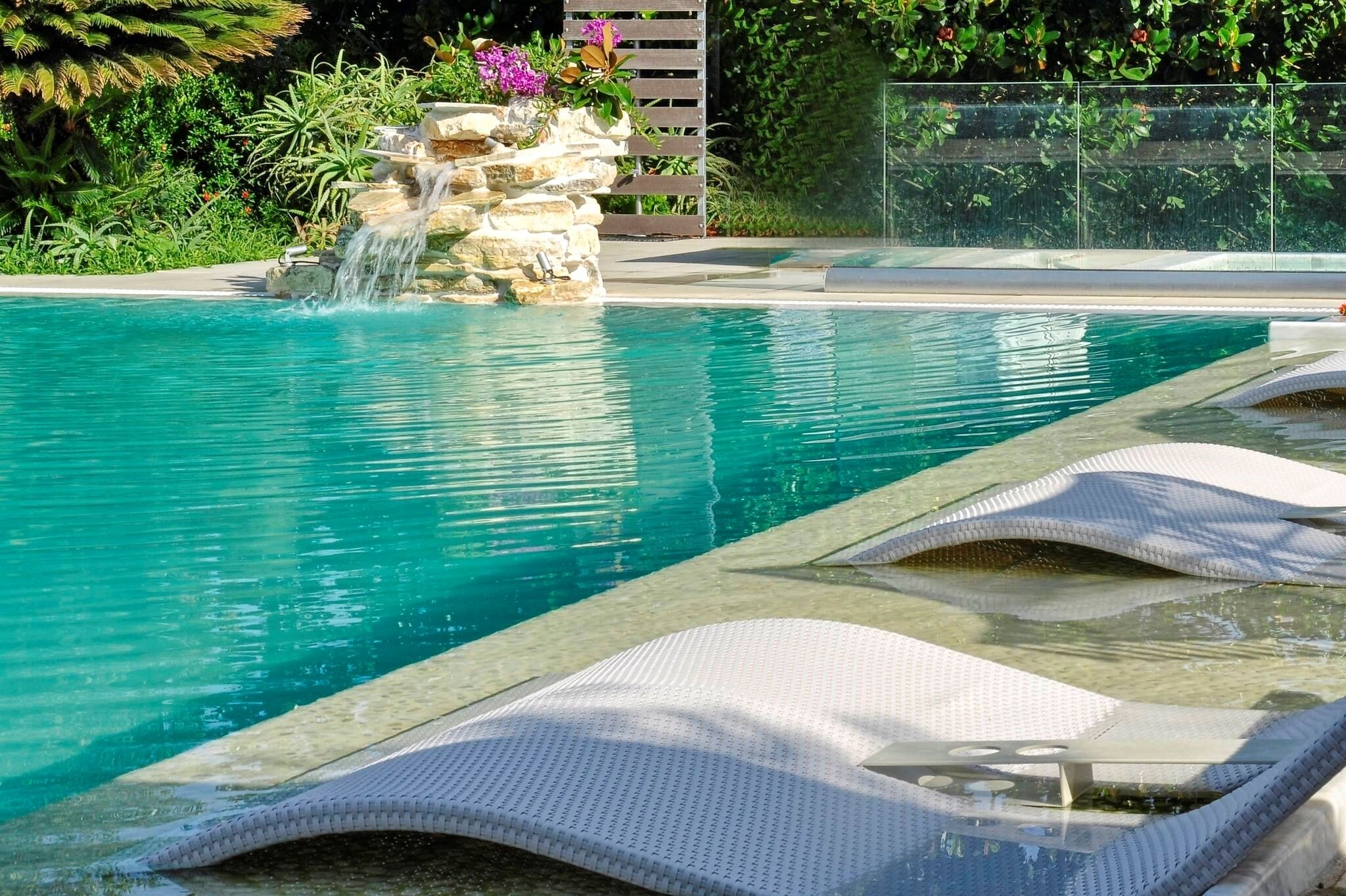 outdoor pool, pool umbrellas, pool loungers