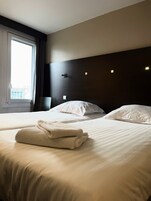 Standard Room, 2 Twin Beds, City View | Desk, blackout drapes, soundproofing, iron/ironing board (on request)