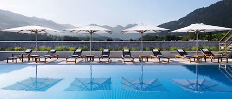 Indoor pool, outdoor pool, open 8 AM to 8 PM, pool umbrellas