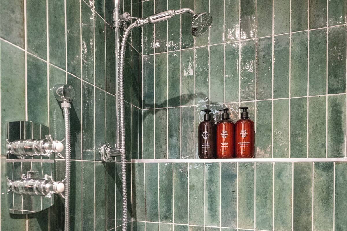 shower, hair dryer, bathrobes, slippers