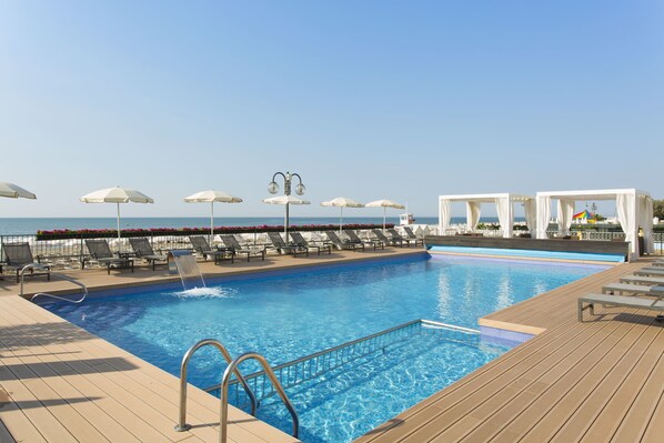 Outdoor pool, open 9 AM to 6 PM, pool umbrellas, sun loungers