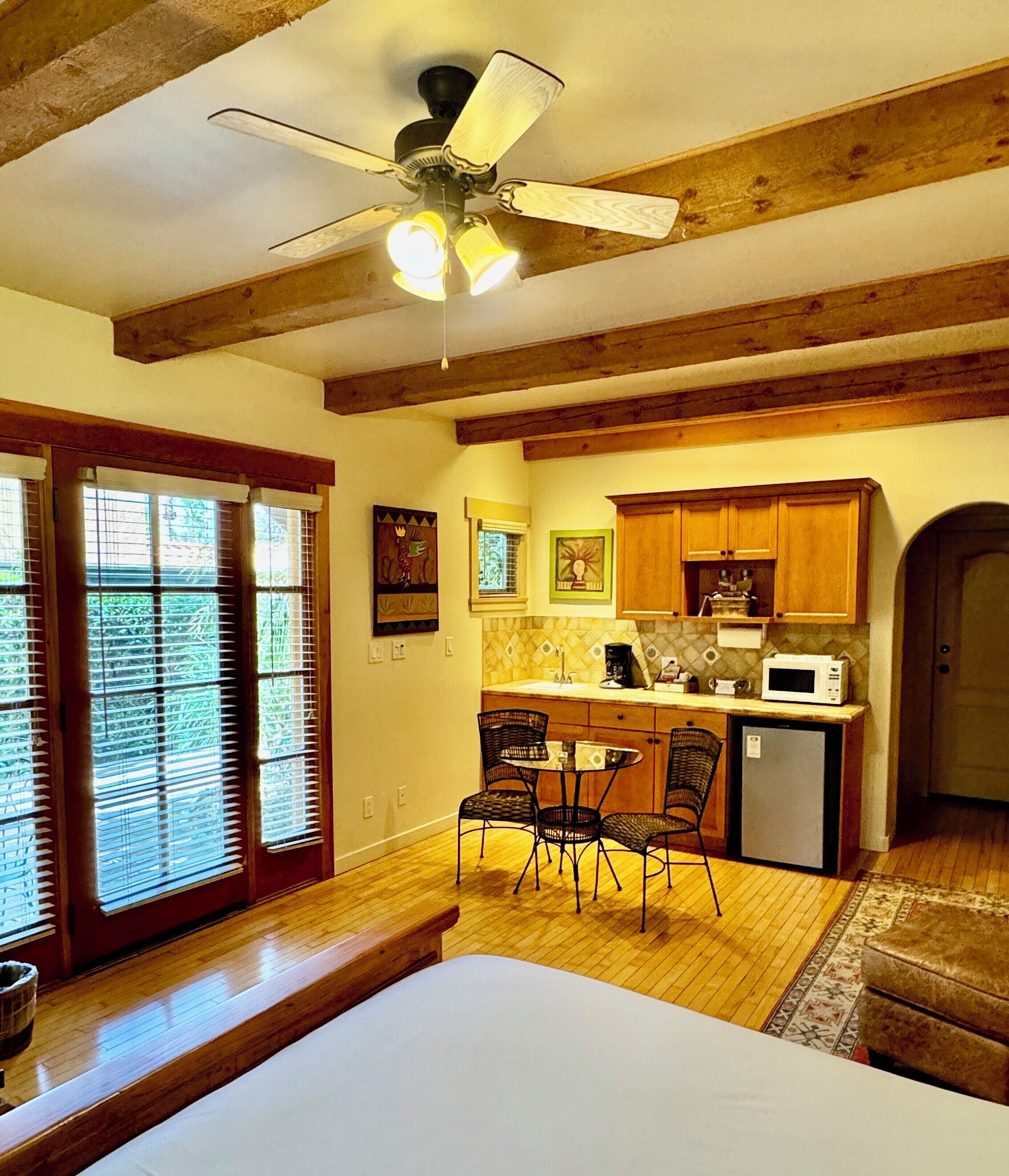 deluxe king room  | living area | tv, dvd player