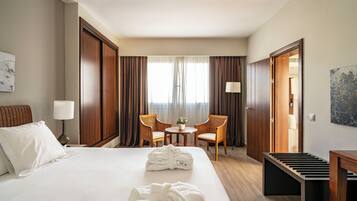 Luxe beddengoed, donsdekens, een minibar, een kluis op de kamer