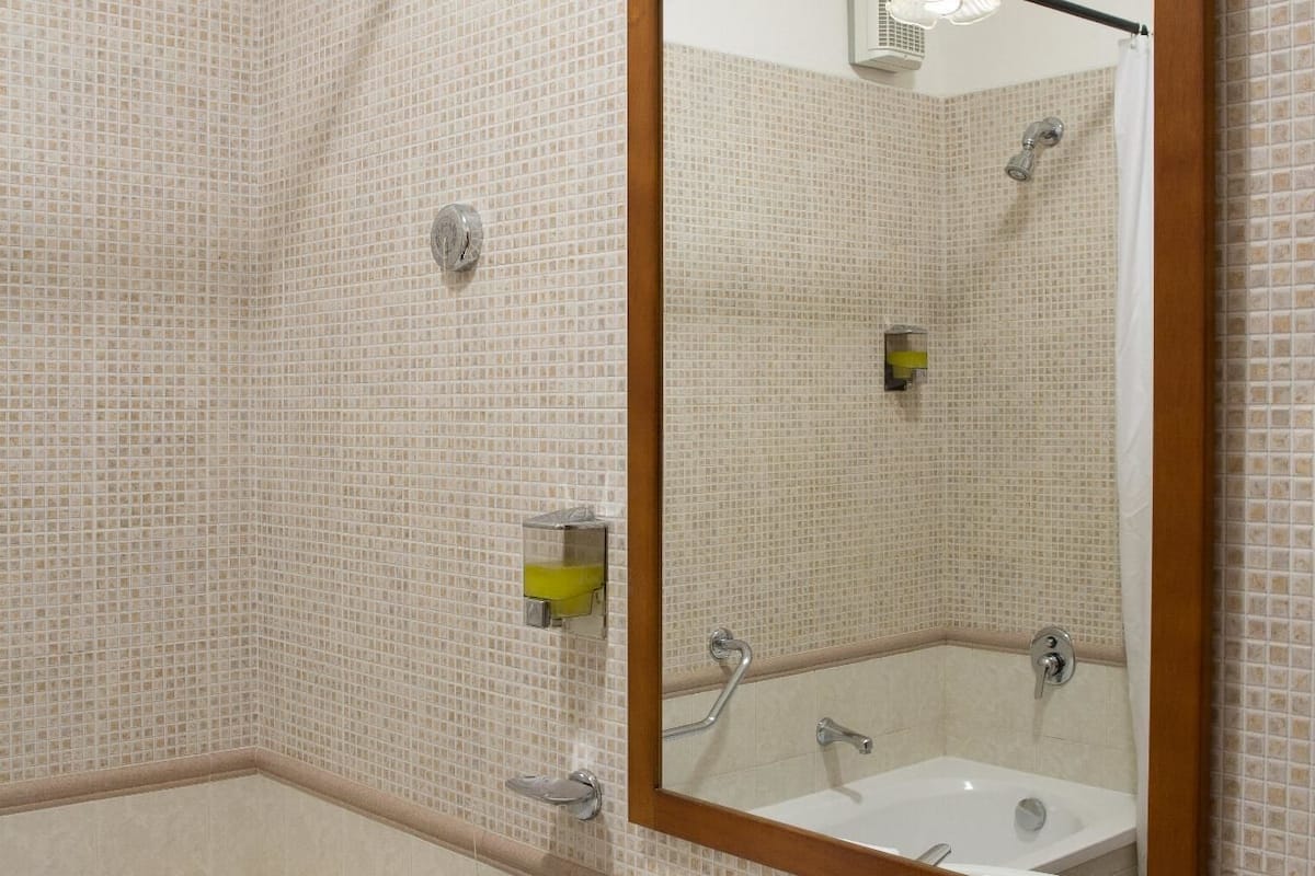 deep-soaking bathtub, hair dryer, towels