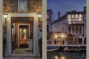 A historic building with a sign reading "HOTEL PAUSANIA" and a pool area with boats. - Hotel Pausania (Venice)