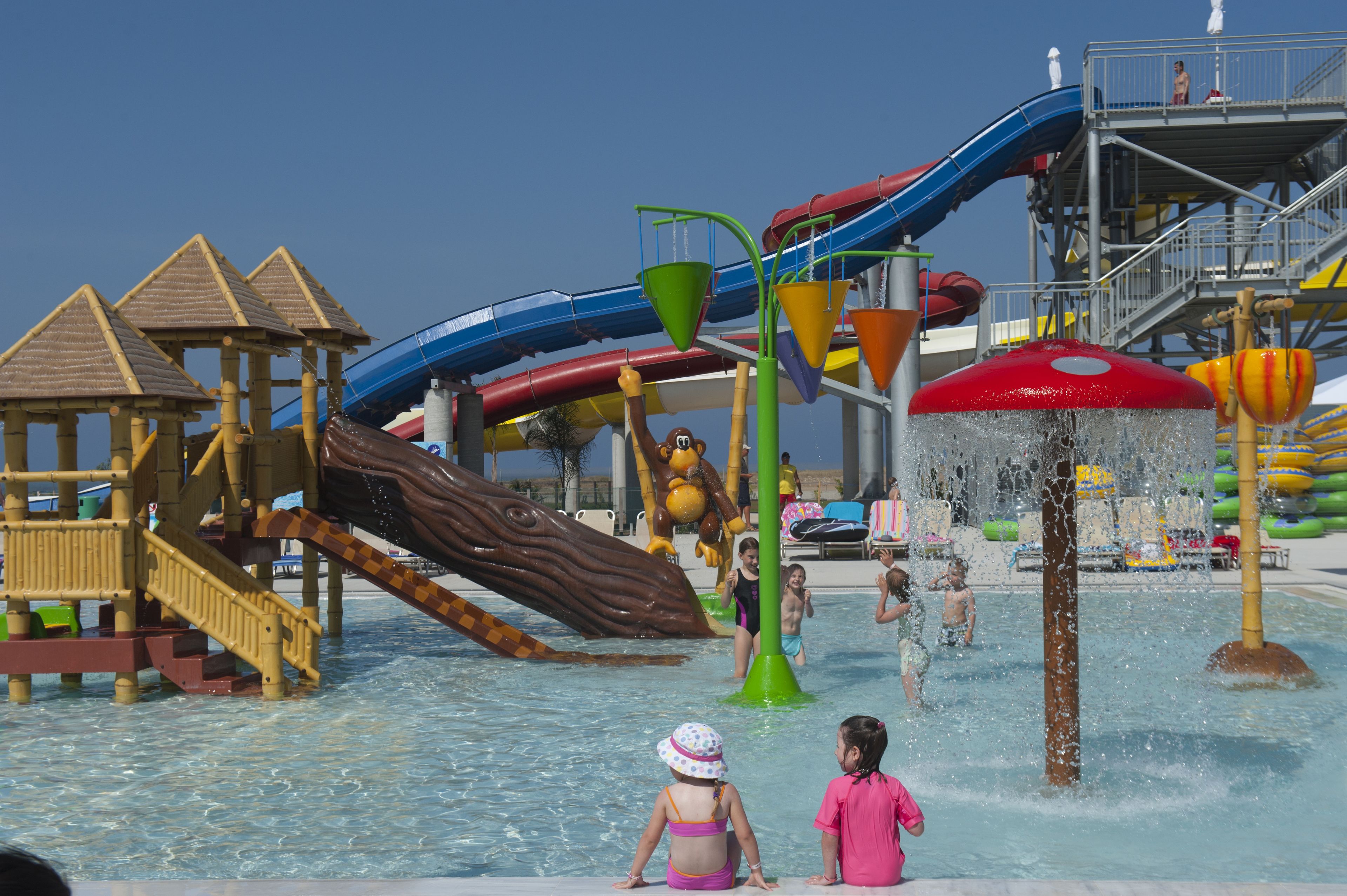 A water park with multiple slides and play structures.