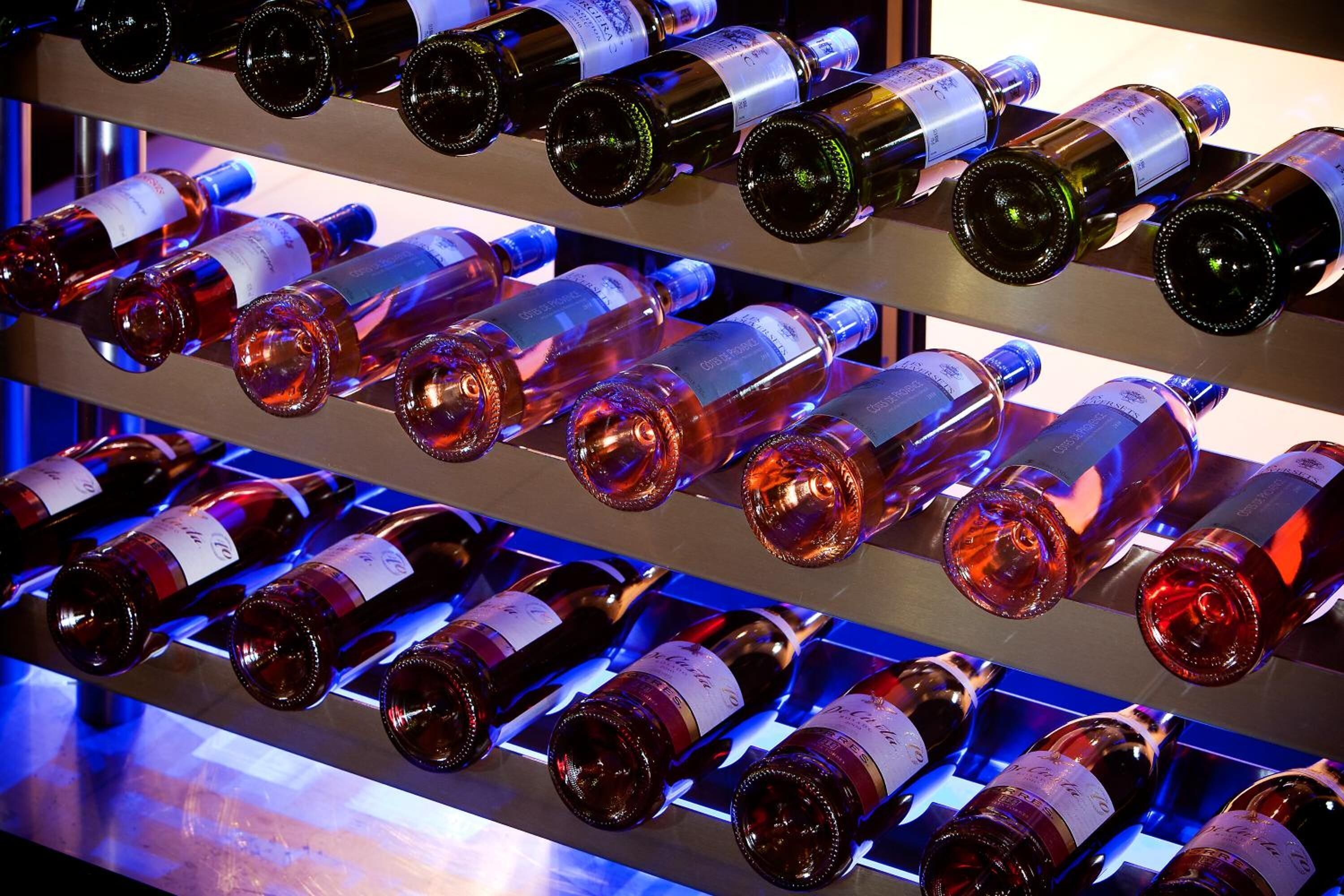 A wine rack with multiple bottles of wine.