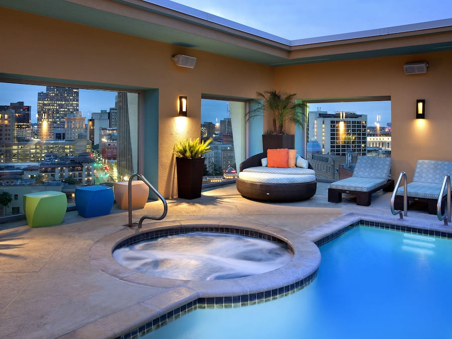 Outdoor pool, a heated pool, open 8:00 AM to 10:00 PM, free cabanas