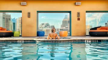 Outdoor pool, a heated pool, open 8:00 AM to 10:00 PM, free cabanas