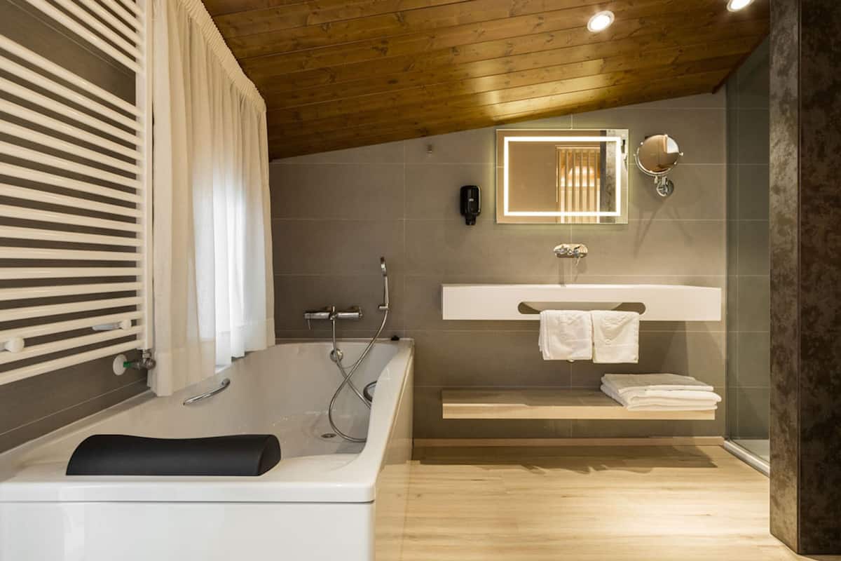 luxury suite | bathroom | shower, free toiletries, hair dryer, towels