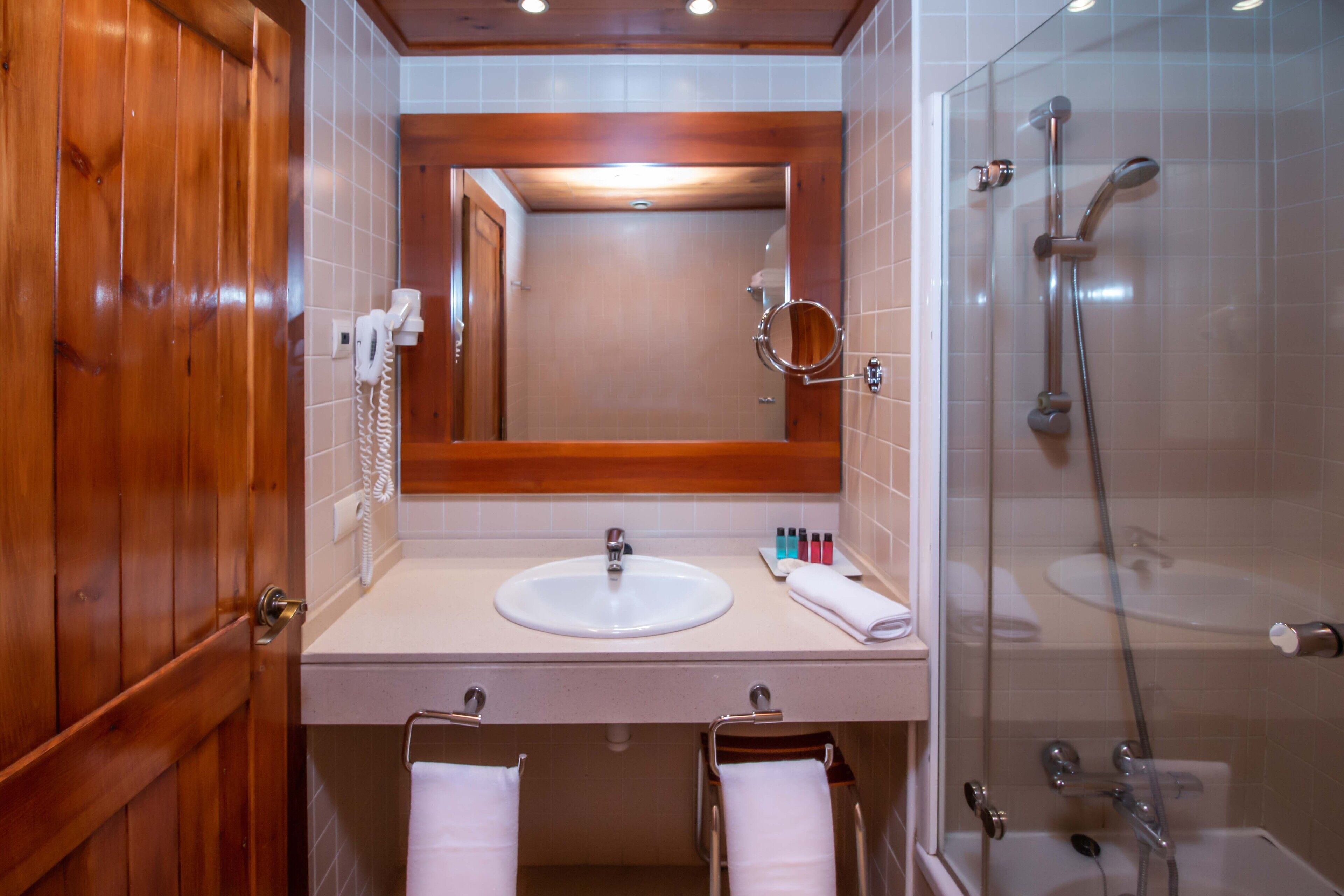 combined shower/bathtub, jetted bath, rainfall showerhead, hair dryer