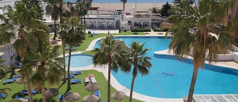 Indoor pool, 2 outdoor pools, open 10 AM to 8:00 PM, pool umbrellas